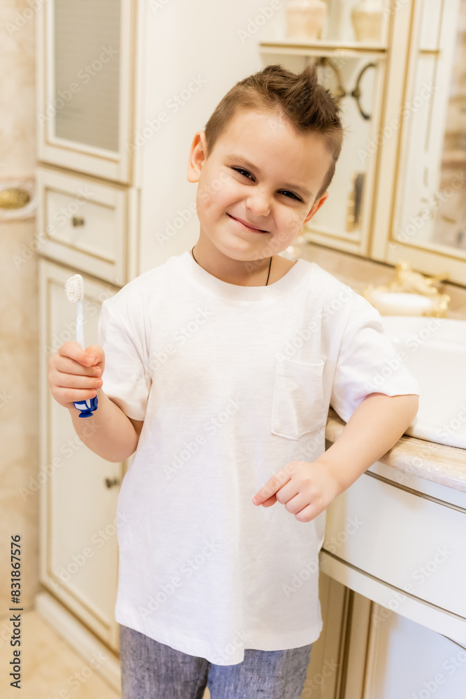 little boy brushes his teeth in the bathroom at home little boy brushes his teeth in the bathroom at home