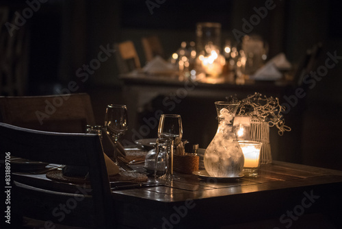 Close up of a dinner table, rustic, candle light, moody, 