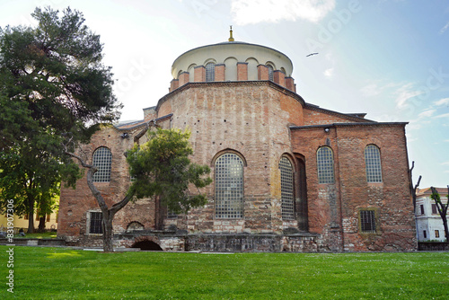 The facade of the Aya Irina Church - a famous landmark of Istanbul, preserved from Byzantine times. View of the Church of St. Irene from the east, from the apse. Topkapi, Türkiye. photo