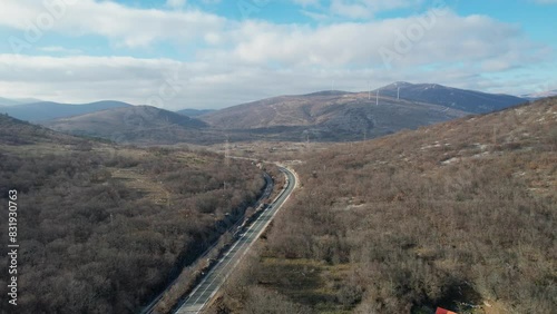Road and a railway with the beautiful mountainous background in the region of Lika, Croatia, Europe (ID: 831930763)