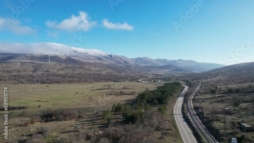 Road and a railway with the beautiful mountainous background in the region of Lika, Croatia, Europe (ID: 831931774)