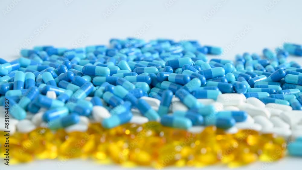 Pills on a white table. Medicine in pills. A drug for treatment. Nutritional supplement, pain reliever, vitamins. Pills on a white table. Medicine in pills. A drug for treatment. Nutritional supplement, pain reliever, vitamins.