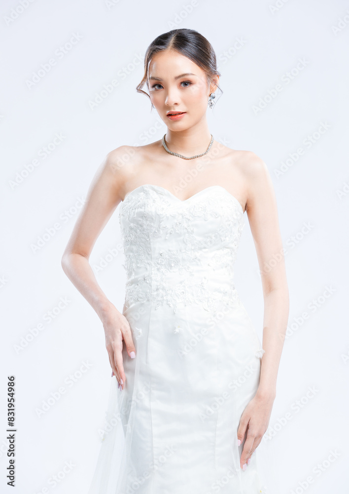 Asian young beautiful female portrait attractive model gorgeous charming bride wearing fashion wedding dress luxury perfect style, posing standing smile looking camera isolated white background studio Asian young beautiful female portrait attractive model gorgeous charming bride wearing fashion wedding dress luxury perfect style, posing standing smile looking camera isolated white background studio