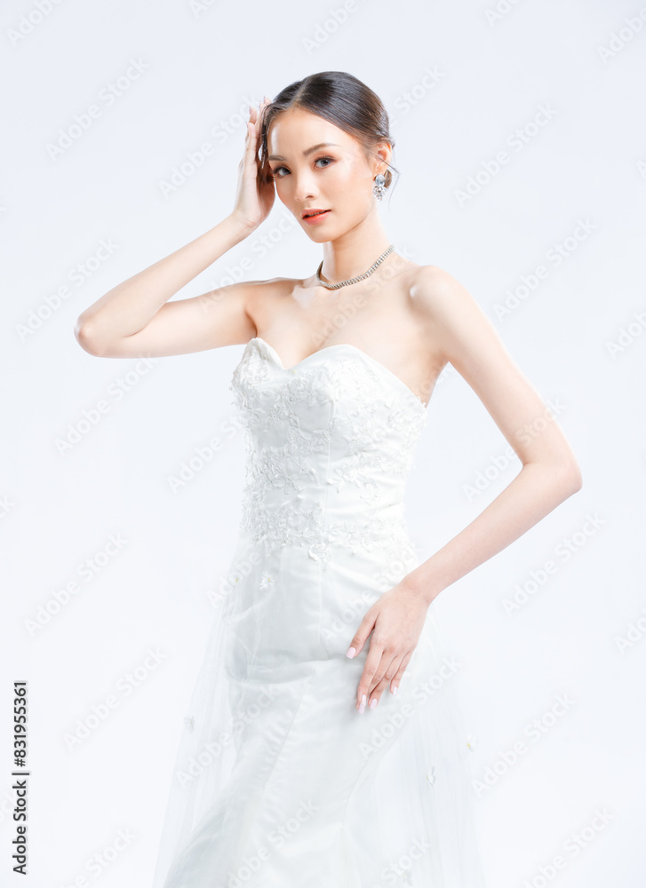 Asian young beautiful female portrait attractive model gorgeous charming bride wearing fashion wedding dress luxury perfect style, posing standing smile looking camera isolated white background studio Asian young beautiful female portrait attractive model gorgeous charming bride wearing fashion wedding dress luxury perfect style, posing standing smile looking camera isolated white background studio