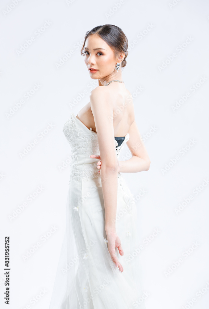Asian young beautiful female portrait attractive model gorgeous charming bride wearing fashion wedding dress luxury perfect style, posing standing smile looking camera isolated white background studio Asian young beautiful female portrait attractive model gorgeous charming bride wearing fashion wedding dress luxury perfect style, posing standing smile looking camera isolated white background studio