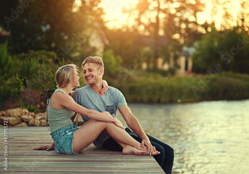 Konstfotografi Couple, people and happy on dock in lake for love, bonding and support with care and fun in California