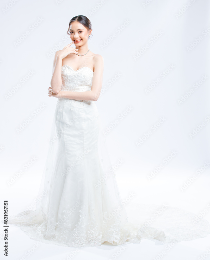 Asian young beautiful female portrait attractive model gorgeous charming bride wearing fashion wedding dress luxury perfect style, posing standing smile looking camera isolated white background studio Asian young beautiful female portrait attractive model gorgeous charming bride wearing fashion wedding dress luxury perfect style, posing standing smile looking camera isolated white background studio