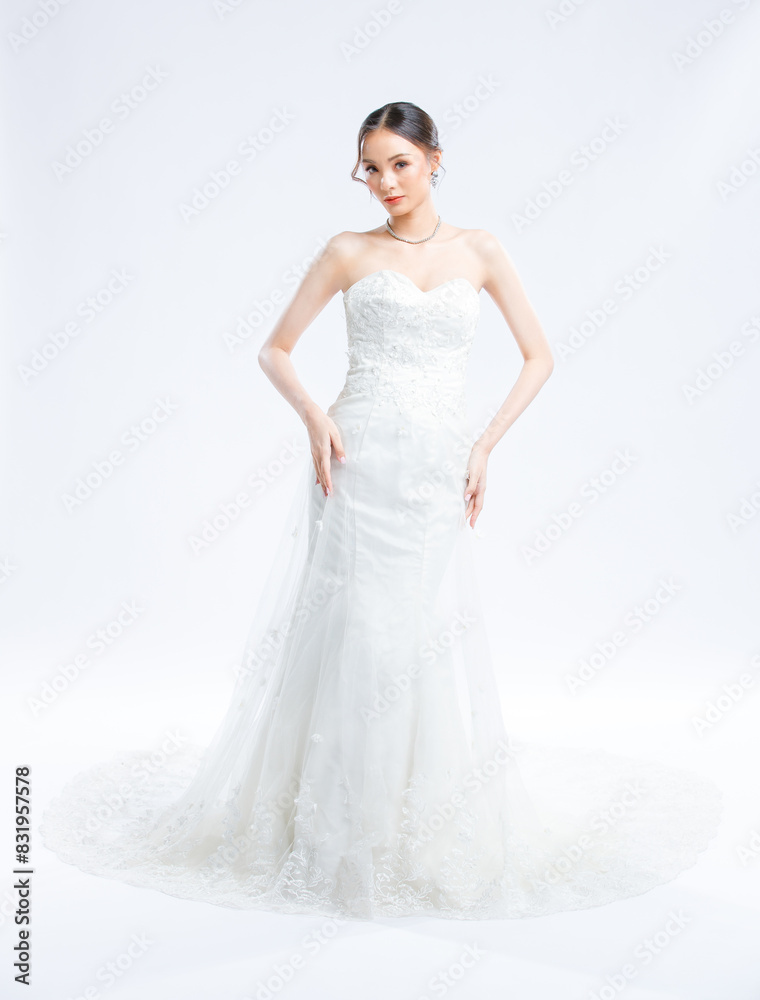 Asian young beautiful female portrait attractive model gorgeous charming bride wearing fashion wedding dress luxury perfect style, posing standing smile looking camera isolated white background studio Asian young beautiful female portrait attractive model gorgeous charming bride wearing fashion wedding dress luxury perfect style, posing standing smile looking camera isolated white background studio