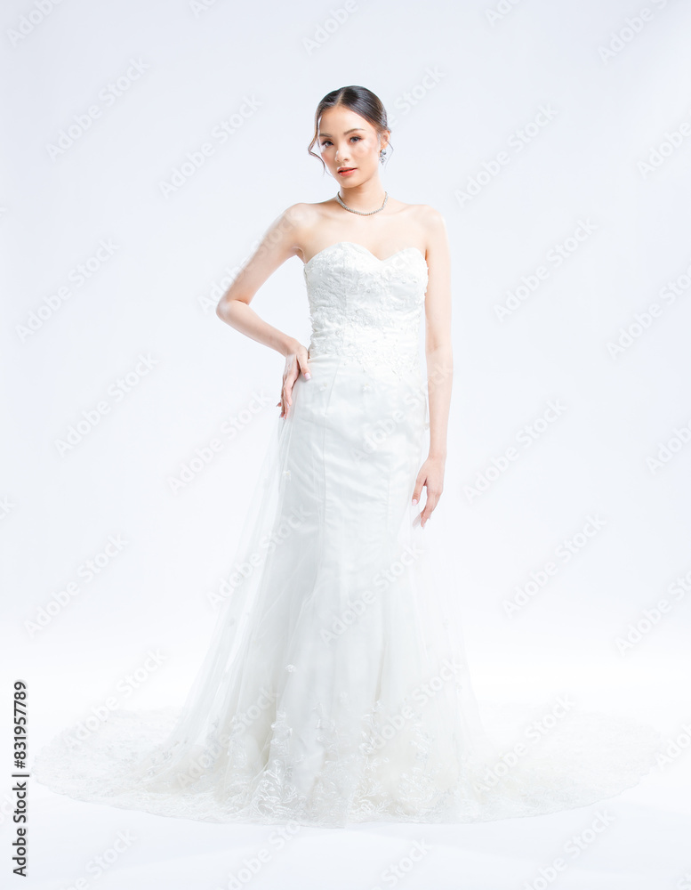 Asian young beautiful female portrait attractive model gorgeous charming bride wearing fashion wedding dress luxury perfect style, posing standing smile looking camera isolated white background studio Asian young beautiful female portrait attractive model gorgeous charming bride wearing fashion wedding dress luxury perfect style, posing standing smile looking camera isolated white background studio