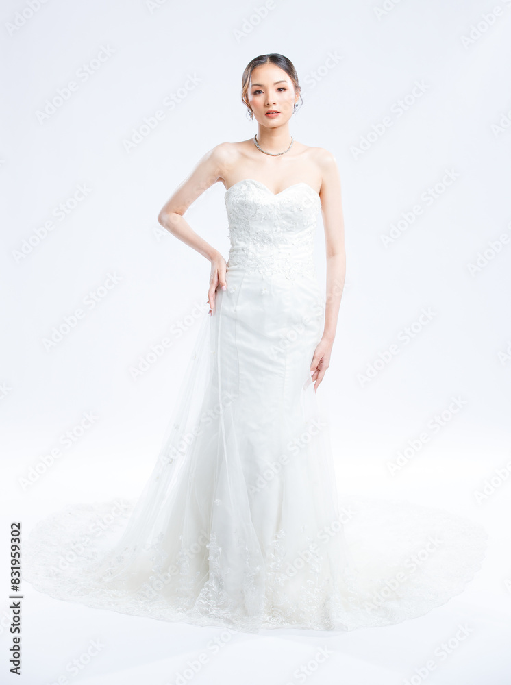 Asian young beautiful female portrait attractive model gorgeous charming bride wearing fashion wedding dress luxury perfect style, posing standing smile looking camera isolated white background studio Asian young beautiful female portrait attractive model gorgeous charming bride wearing fashion wedding dress luxury perfect style, posing standing smile looking camera isolated white background studio