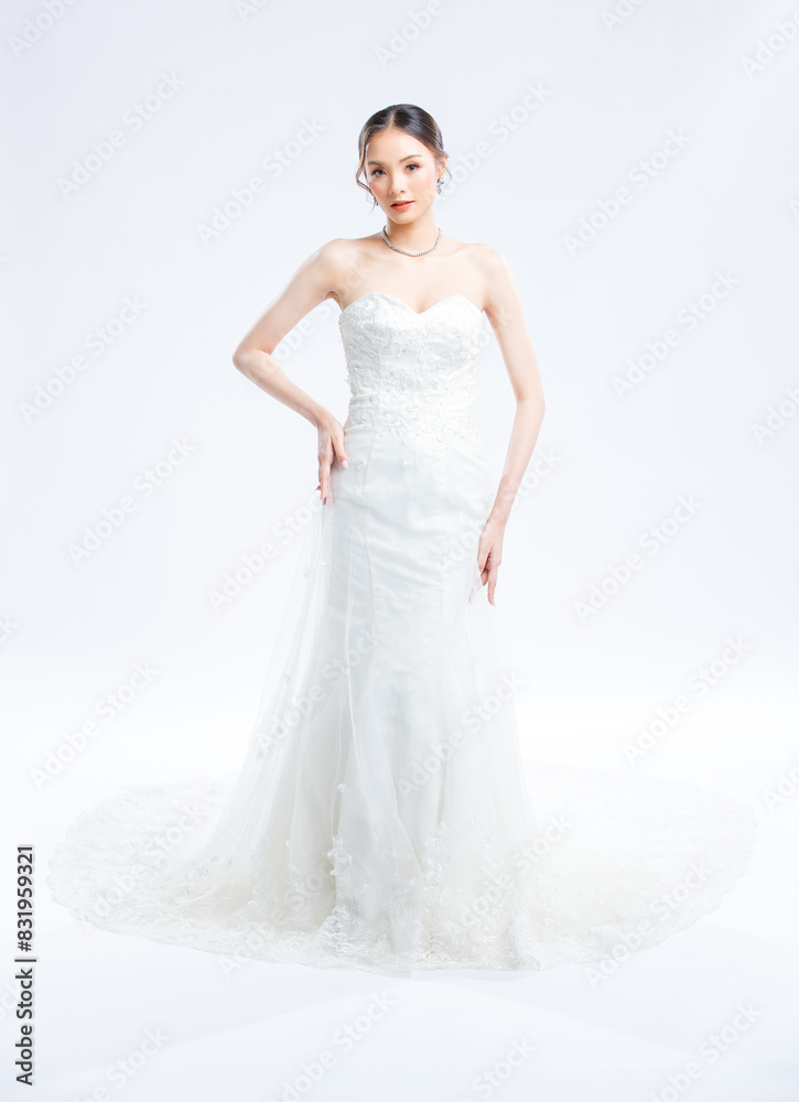 Asian young beautiful female portrait attractive model gorgeous charming bride wearing fashion wedding dress luxury perfect style, posing standing smile looking camera isolated white background studio