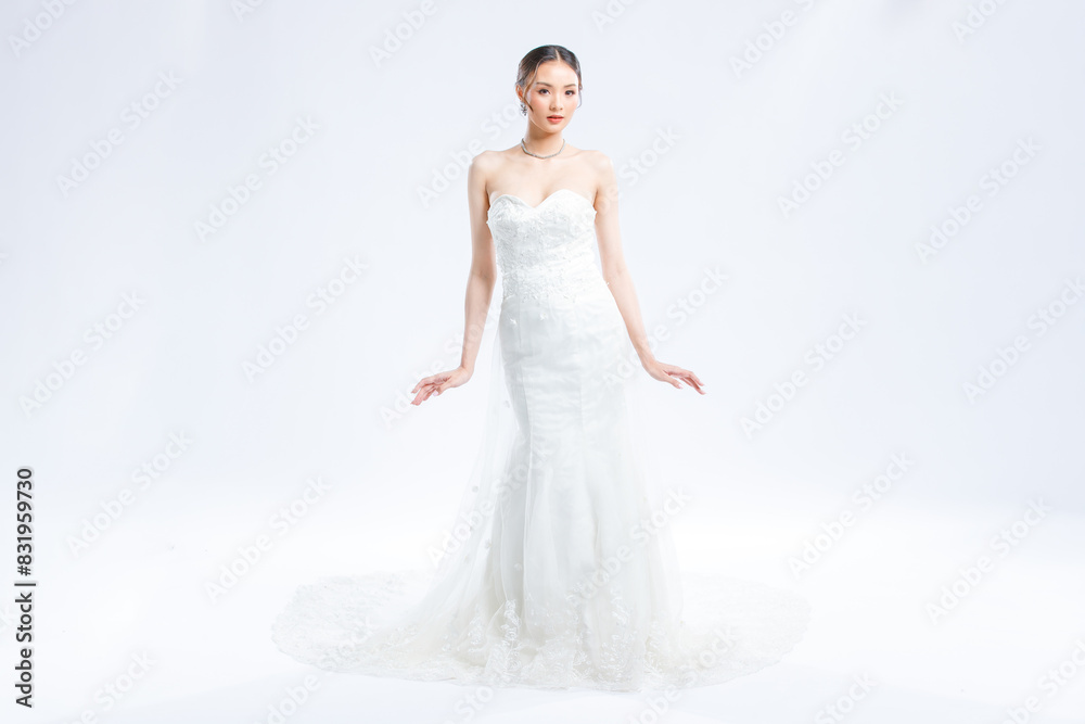 Asian young beautiful female portrait attractive model gorgeous charming bride wearing fashion wedding dress luxury perfect style, posing standing smile looking camera isolated white background studio