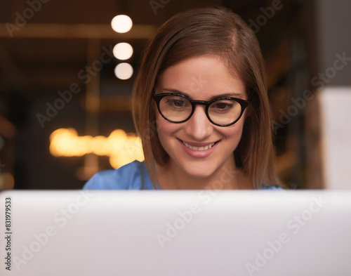 Woman, happy and work with laptop in cafe, freelancer and entrepreneur networking on online website. Smile, reading blog and internet or social media communication, creative businesswoman and tech