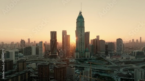 Cinematic Istanbul skyline with urban skyscrapers at sunset. Modern business buildings area of the city. Establisment and insert shot. Aerial drone 4K Turkey photo