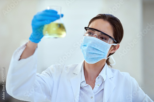 Woman, scientist and chemical in glass for scientific sample, reaction and research. Healthcare, musk and test tube with experiment study or innovation for vaccine, cure and experiment for medicine