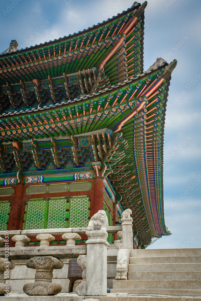 Low angle view of colorful patterned gyeongbokgung roof against sky