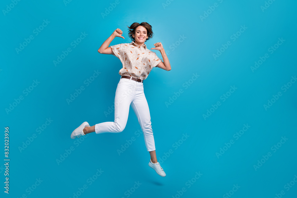 Photo of funky gorgeous girl fly air run demonstrate herself stylish clothes collection isolated on blue color background Photo of funky gorgeous girl fly air run demonstrate herself stylish clothes collection isolated on blue color background