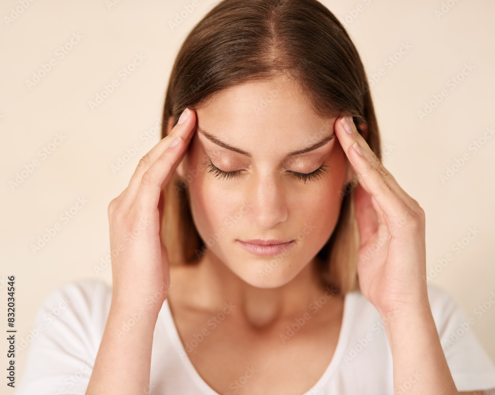 Headache, stress and face of woman with anxiety for crisis, burnout and frustrated for brain fog by wall background. Pain, temple massage and tired girl with migraine or dizzy for vertigo and health Headache, stress and face of woman with anxiety for crisis, burnout and frustrated for brain fog by wall background. Pain, temple massage and tired girl with migraine or dizzy for vertigo and health
