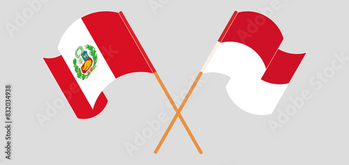 Crossed and waving flags of Peru and Indonesia
