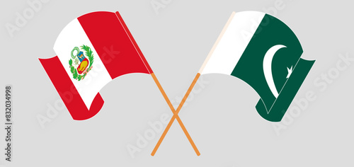 Crossed and waving flags of Peru and Pakistan