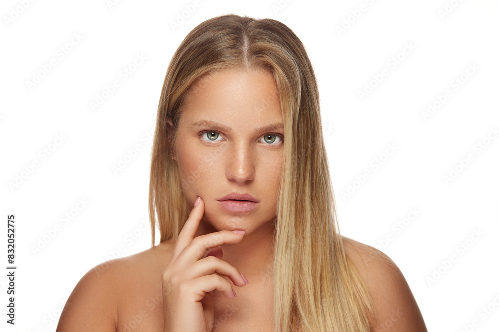 Portrait of beautiful natural young blonde woman with bare shoulders Portrait of beautiful natural young blonde woman with bare shoulders