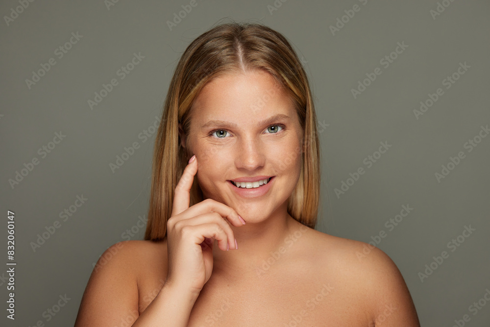Portrait of beautiful natural young blonde woman with bare shoulders Portrait of beautiful natural young blonde woman with bare shoulders