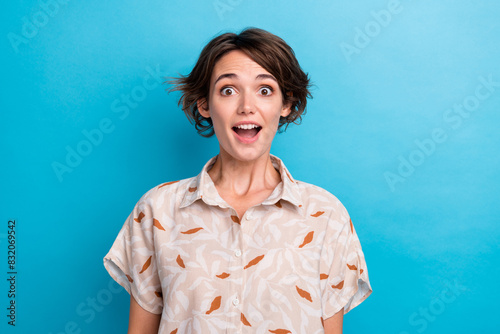 Portrait of speechless positive impressed lady open mouth cant believe isolated on blue color background