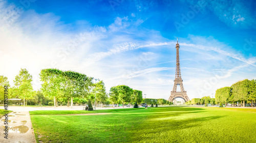 Fényképezés Paris Eiffel Tower over green grass lane in Paris, France