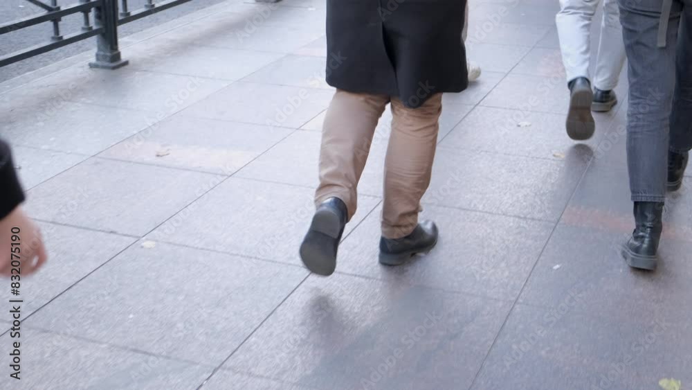 People in casual attire walking on a city street, urban scene with modern and busy atmosphere People in casual attire walking on a city street, urban scene with modern and busy atmosphere