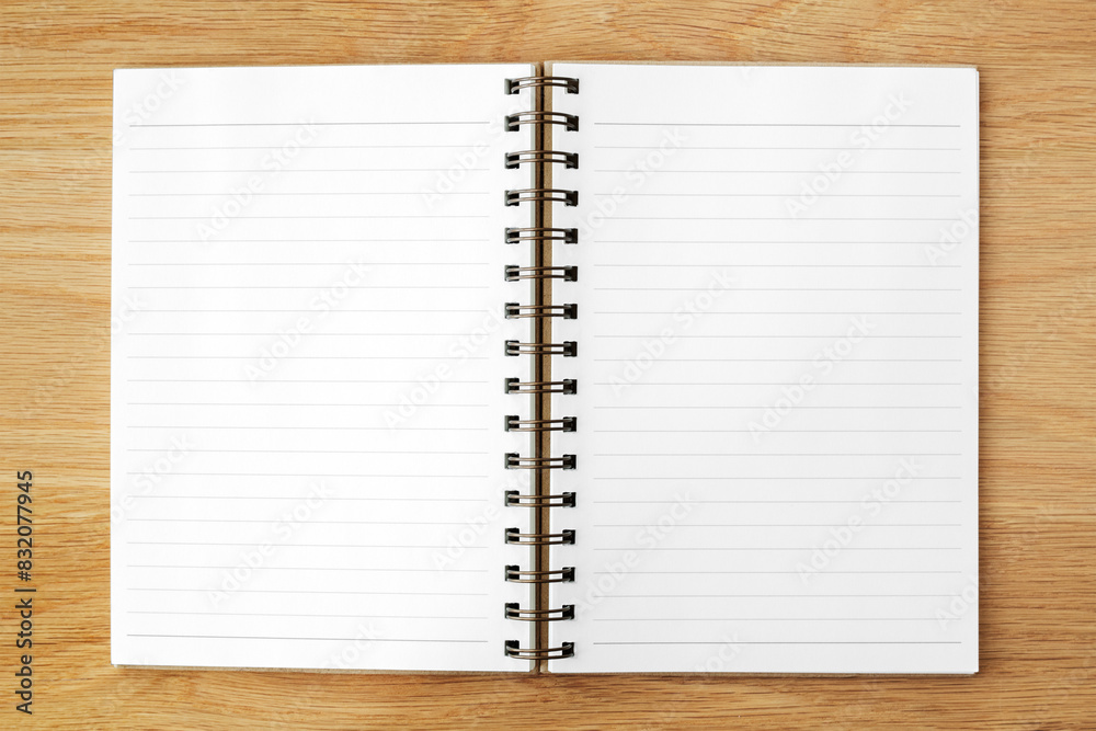 White lined notepaper mockup on a wooden table White lined notepaper mockup on a wooden table