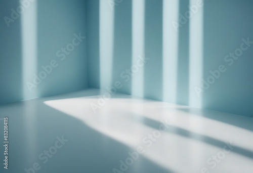 Minimal abstract light blue background for product presentation Shadow and light from windows on pla