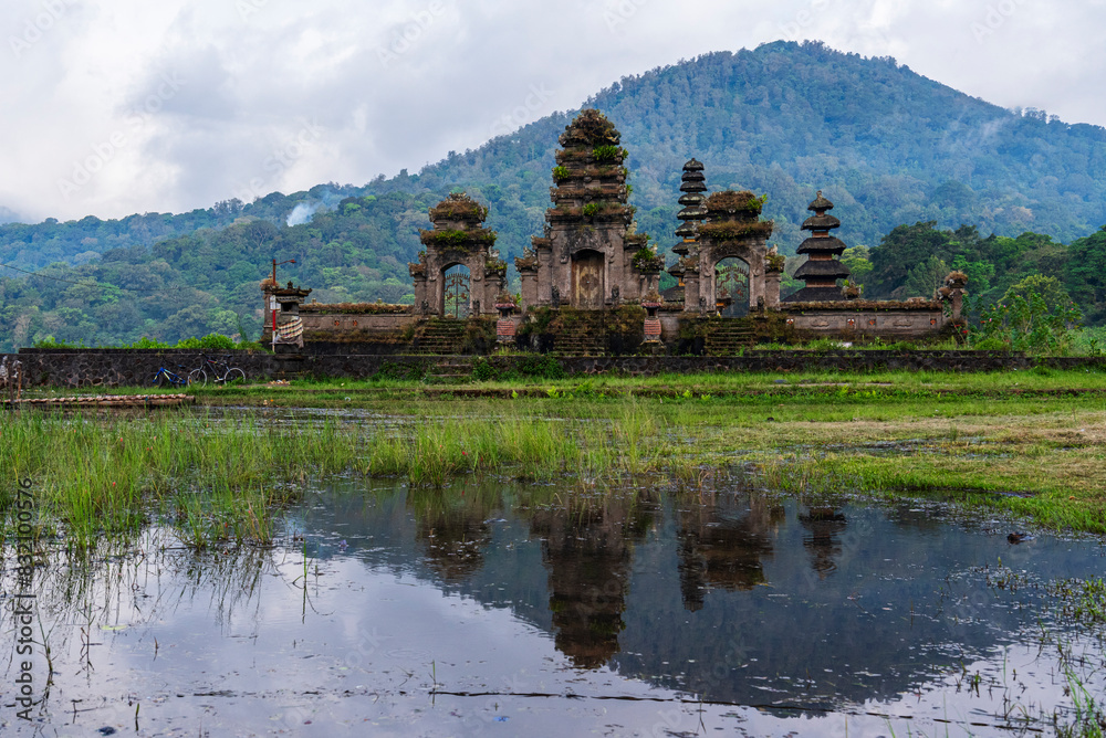 Reflection of the temple Ulun Danu Tamblingan in the water of the lake, Munduk, Bali, Indonesia Reflection of the temple Ulun Danu Tamblingan in the water of the lake, Munduk, Bali, Indonesia