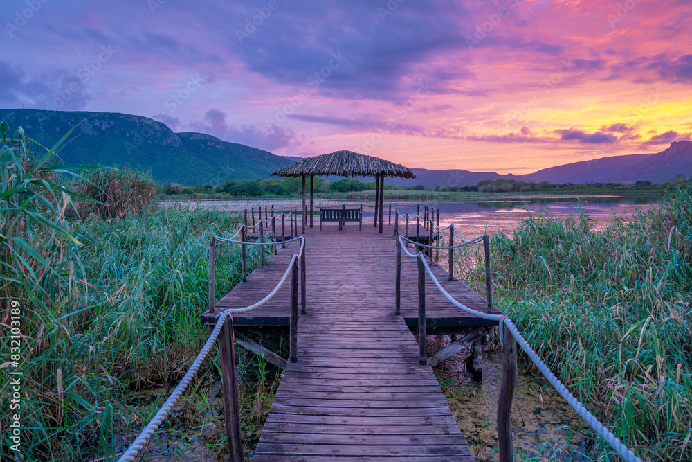 View of Jet lake and Ubombo Mountain from Ghost Mountain Inn at sunrise, Mkuze, KwaZulu-Natal Province, South Africa View of Jet lake and Ubombo Mountain from Ghost Mountain Inn at sunrise, Mkuze, KwaZulu-Natal Province, South Africa