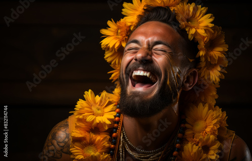 Man laughs with flower garland around his head photo