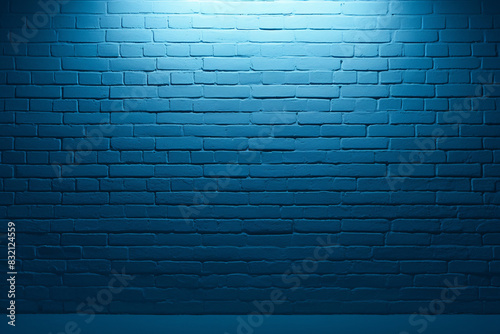 Blue brick wall with a spotlight illuminating the textured surface photo