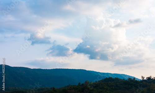 Stunning views of nature and mountains with colorful sunsets in a cloudy sky. Outdoor nature travel background. The world of beauty. Natural panorama photography. © kheartmanee