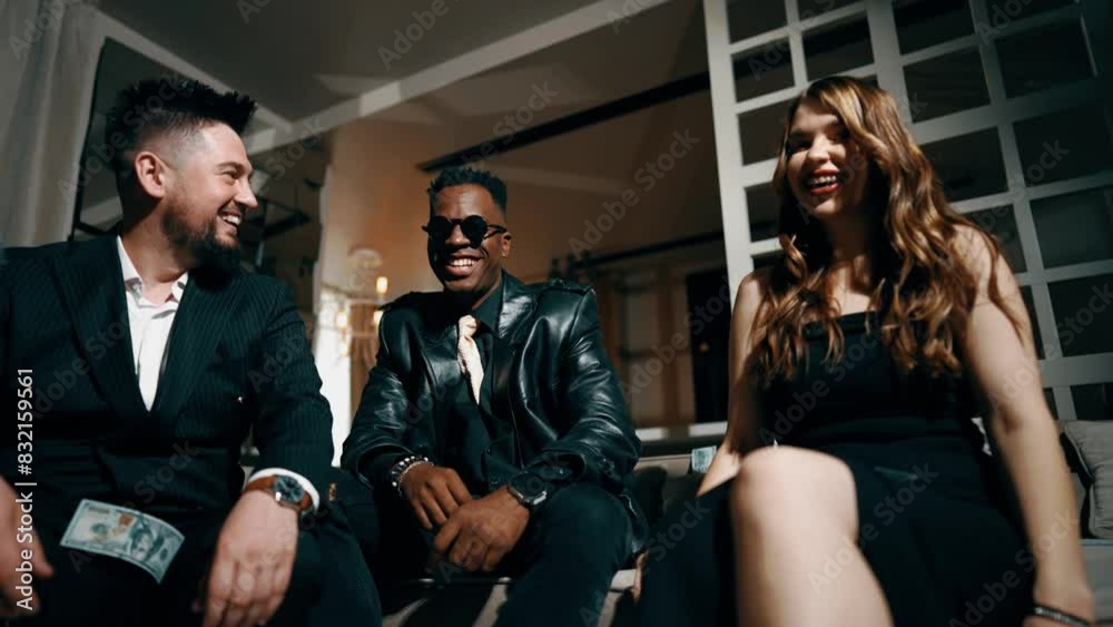 A group of young people in stylish suits throw dollar bills up. Lottery and casino concept. Friends throw money up. 4k A group of young people in stylish suits throw dollar bills up. Lottery and casino concept. Friends throw money up. 4k