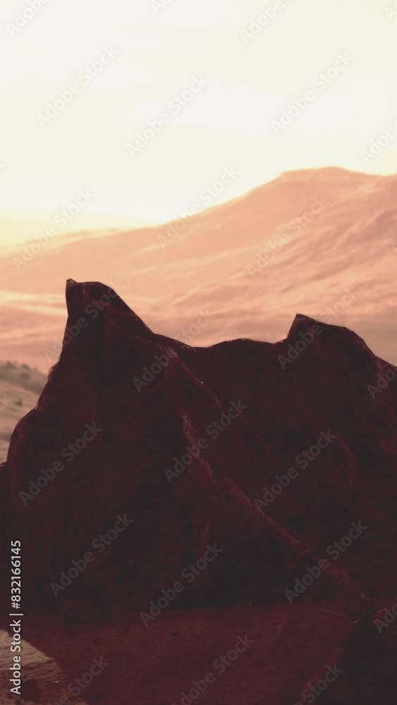 Sunlight bathes the rugged peaks with a warm, ambient glow as evening descends on the mountainous landscape. Sunlight bathes the rugged peaks with a warm, ambient glow as evening descends on the mountainous landscape.