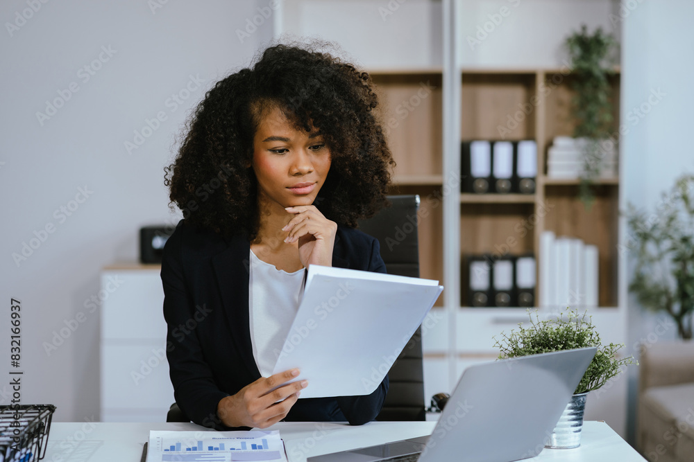Female writes information businessman working on laptop computer writing business plan while sitting in office. Female writes information businessman working on laptop computer writing business plan while sitting in office.