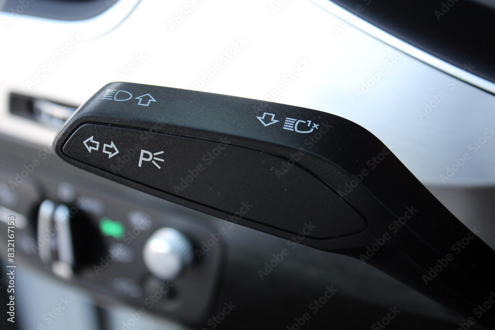 Car interior with light switch. Headlight adjustment knob in the car. Close up of light control in car. Car light switch. Car interior with light switch. Headlight adjustment knob in the car. Close up of light control in car. Car light switch.