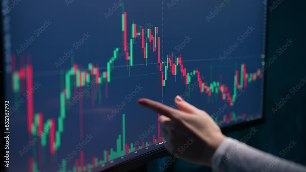 Closeup hand of pensive female trader analyzing graphs and charts stock market on computer screen. Unrecognizable woman investor thinking analyzing digital data. Concept of investing money on share.