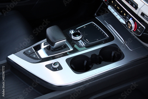 Close up cup holders and Selector automatic transmission. Cup holders inside modern car interior. Car inside. photo