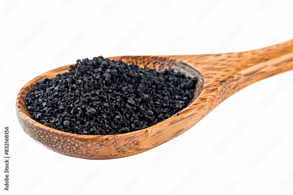 a wooden spoon filled with black seed on top of a white surface a wooden spoon filled with black seed on top of a white surface