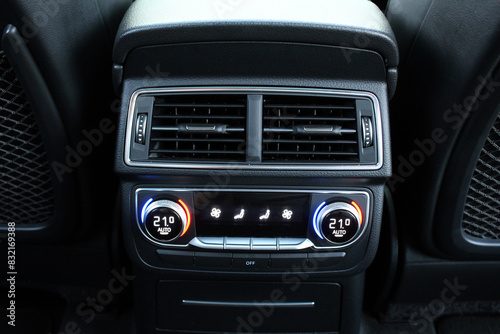 Car ventilation system for rears seats. Rear passenger air conditioning. Climate control for rear passengers. Conditioner dashboard display. Climate control dashboard.