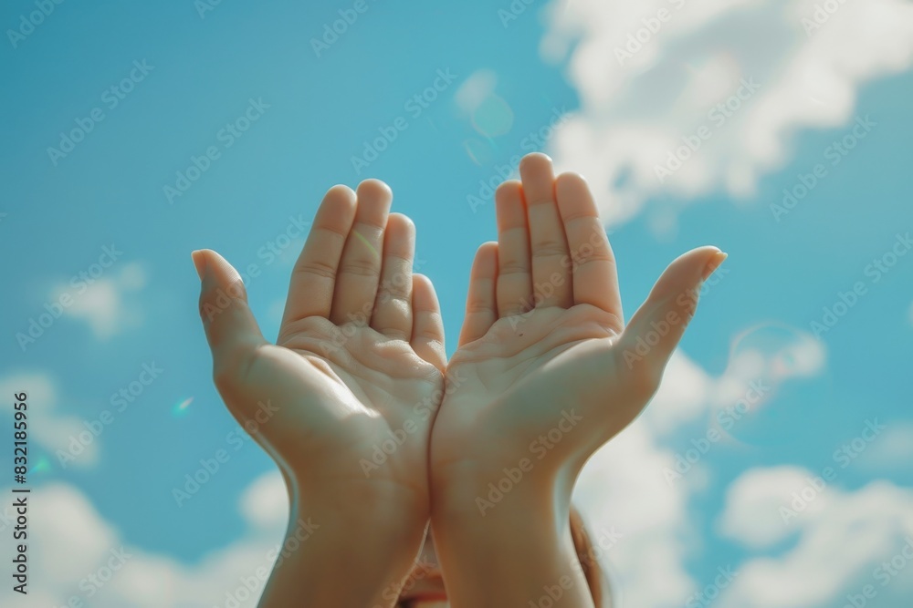 Two hands are held up against a bright blue sky with fluffy clouds, each palm adorned with a simple smiling face drawn on them. Two hands are held up against a bright blue sky with fluffy clouds, each palm adorned with a simple smiling face drawn on them.