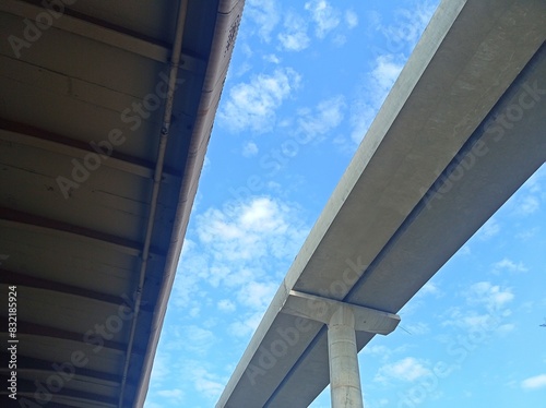 Underpass and Elevated Roadway Against a Blue Sky © sumit