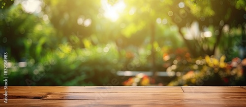 Empty wooden table with party in garden background blurred. Creative banner. Copyspace image