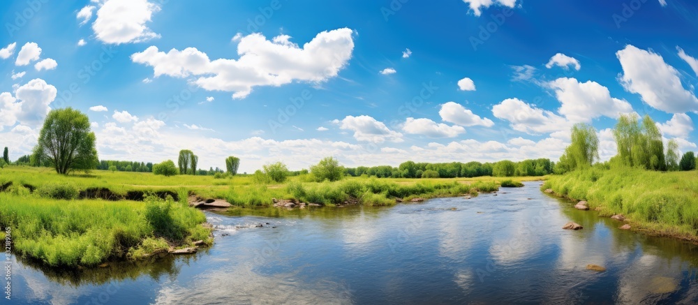 Obraz premium Spring landscape with river and clouds on the blue sky. Creative banner. Copyspace image