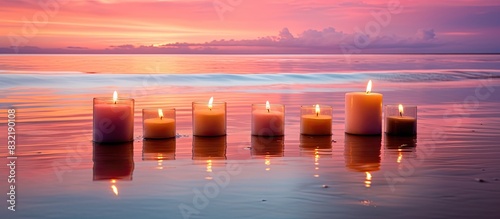Candles against summer sunset background. Creative banner. Copyspace image