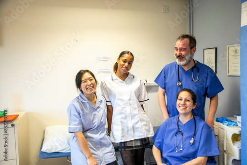 Medical staff smiling in a clinic room, medical practice UK photo